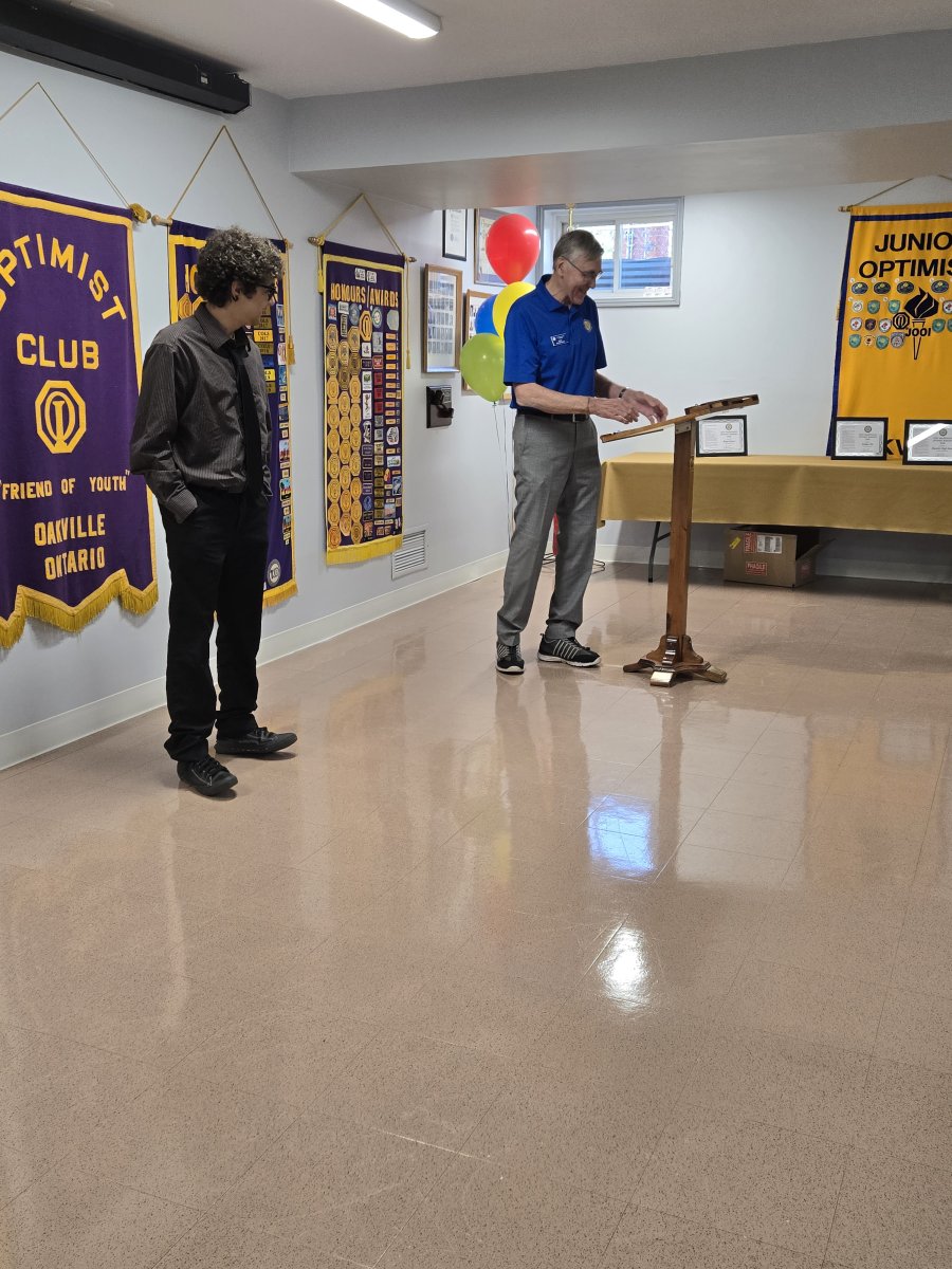 A few ofthe Oratorical Winners and Committee members at the Oakville Optimist Club a few years ago.